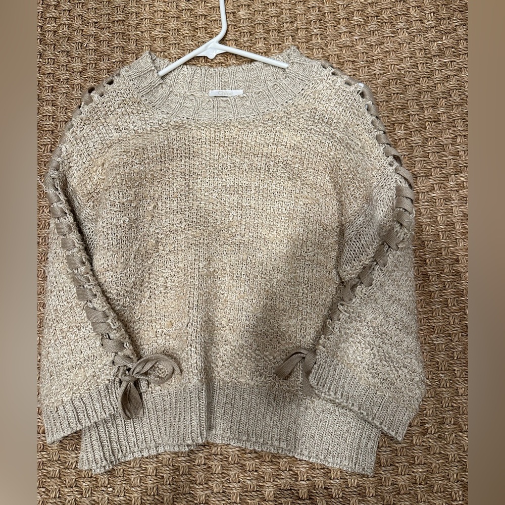 Chloe sweater with ribbons. Really cute with white jeans